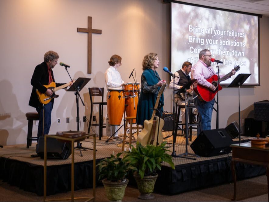thrive band leading worship in the fellowship hall at fpc gastonia